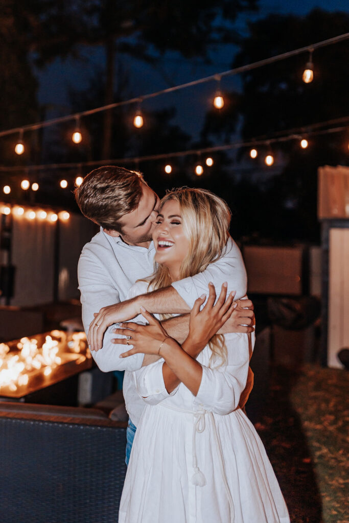 Nashville Engagement Photographer captures man hugging woman from behind