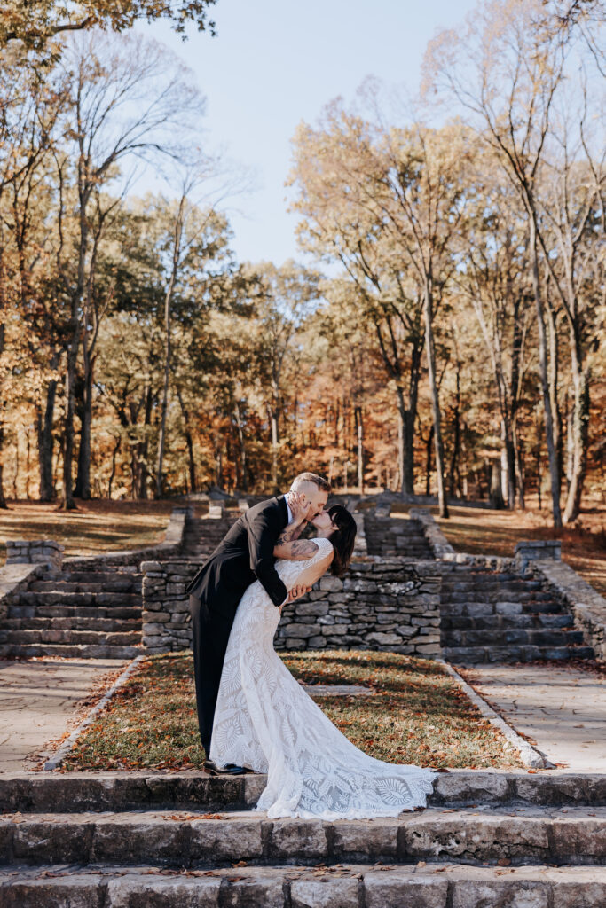 Nashville Elopement Photographer captures bride and groom kissing in front of stairs