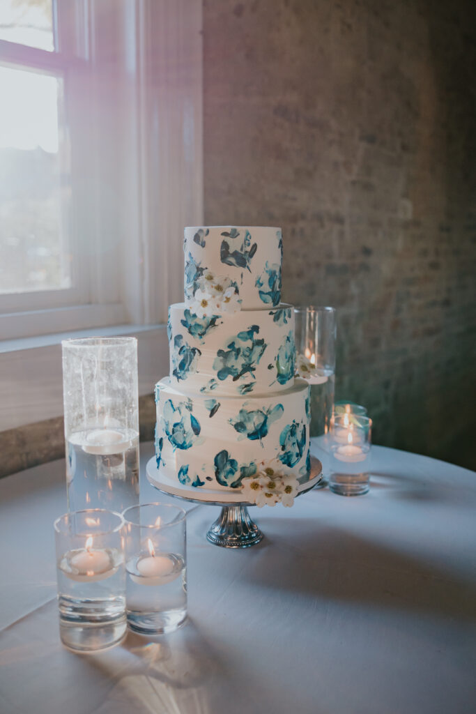 Nashville Elopement Photographer captures three tiered wedding cake with flowers