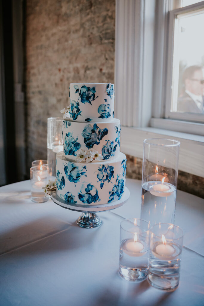 Nashville Elopement Photographer captures wedding cake with flowers throughout