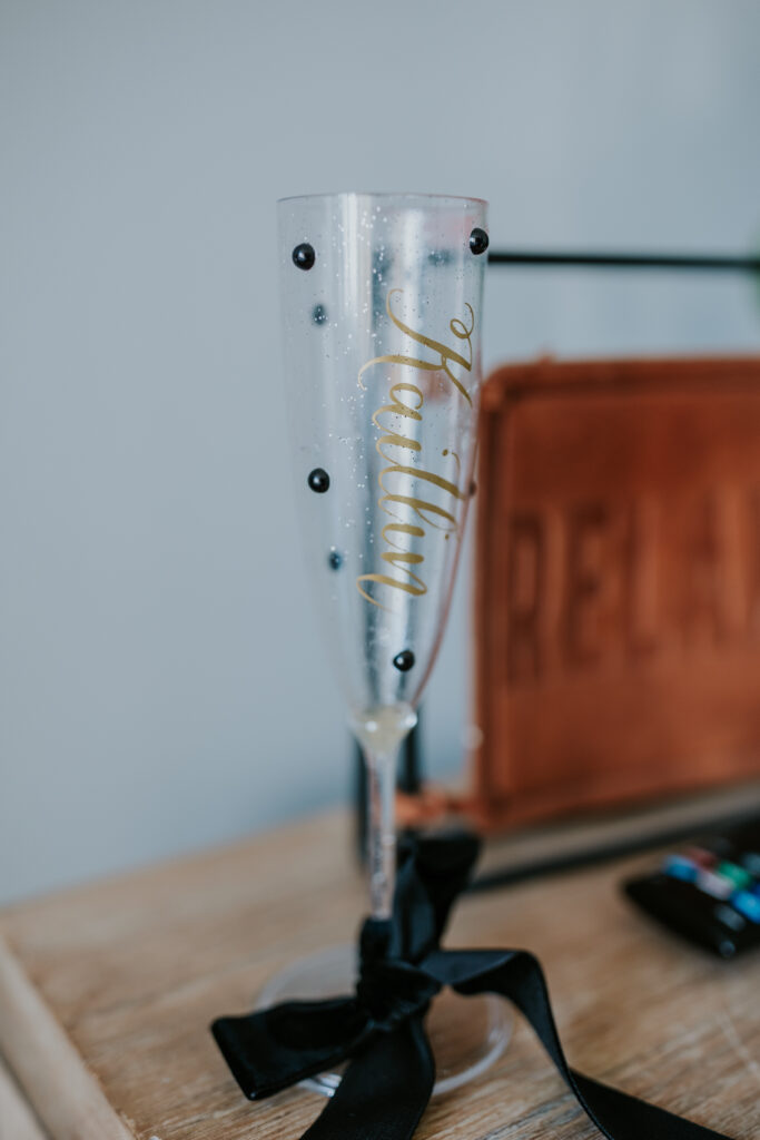 Bride's champagne glass with gems and jewels all over it