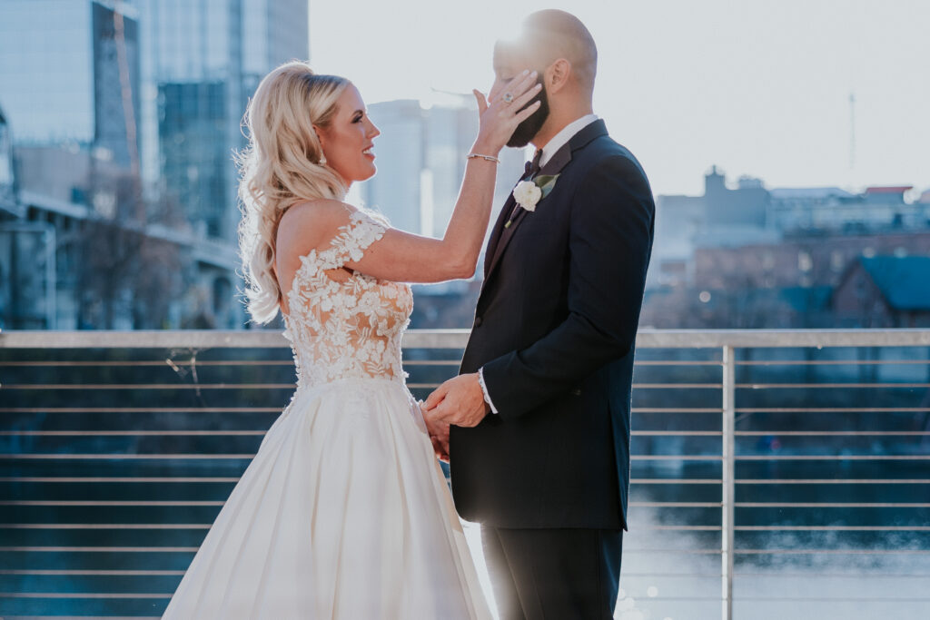 Nashville Wedding Photographer captures bride wiping tears from groom's face