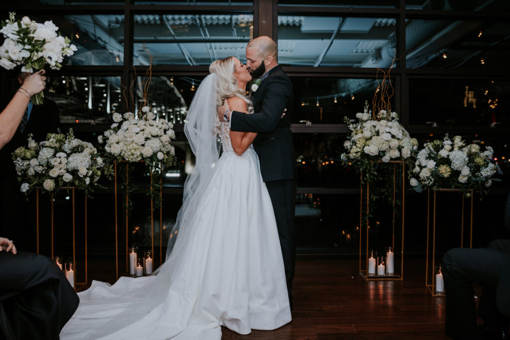 Nashville Wedding Photographer captures bride and groom kissing at ceremony