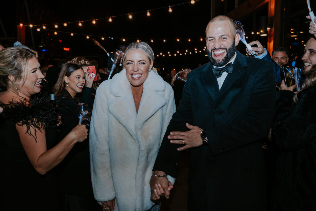 Nashville Wedding Photographer captures bride and groom leaving The Bridge Building wedding