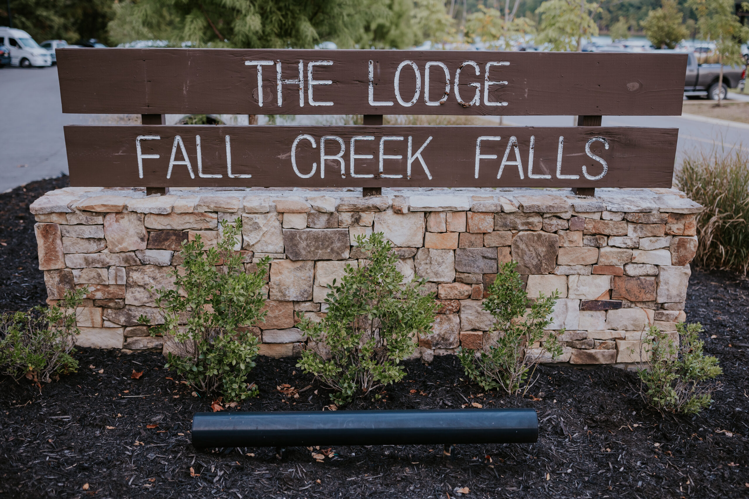 Stone and wood sign for The Lodge at Fall Creek Falls, a beloved destination wedding venue in Tennessee.