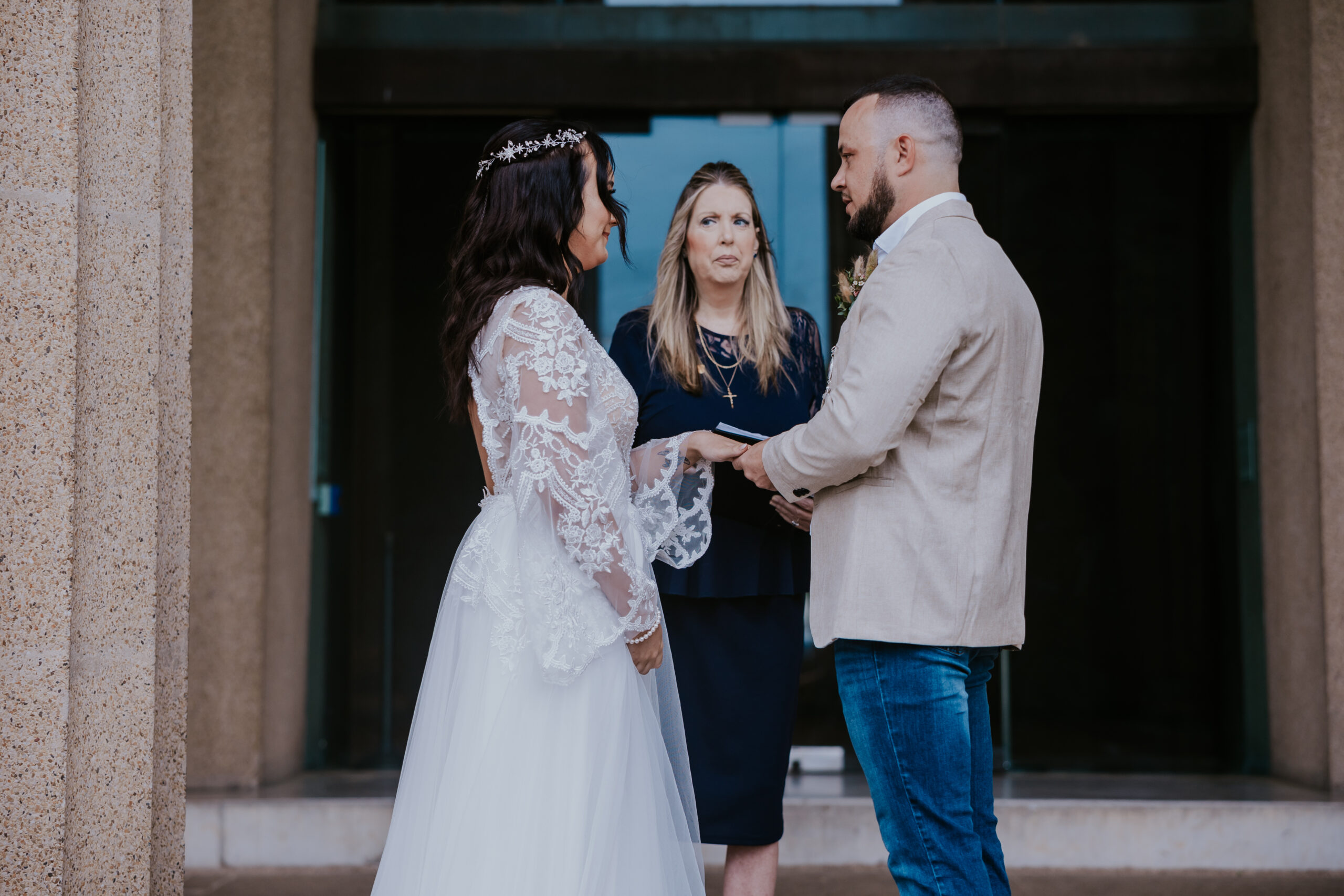 Groom placing a ring on the bride's finger during an emotional vow exchange—perfect moment for a travel wedding photographer.